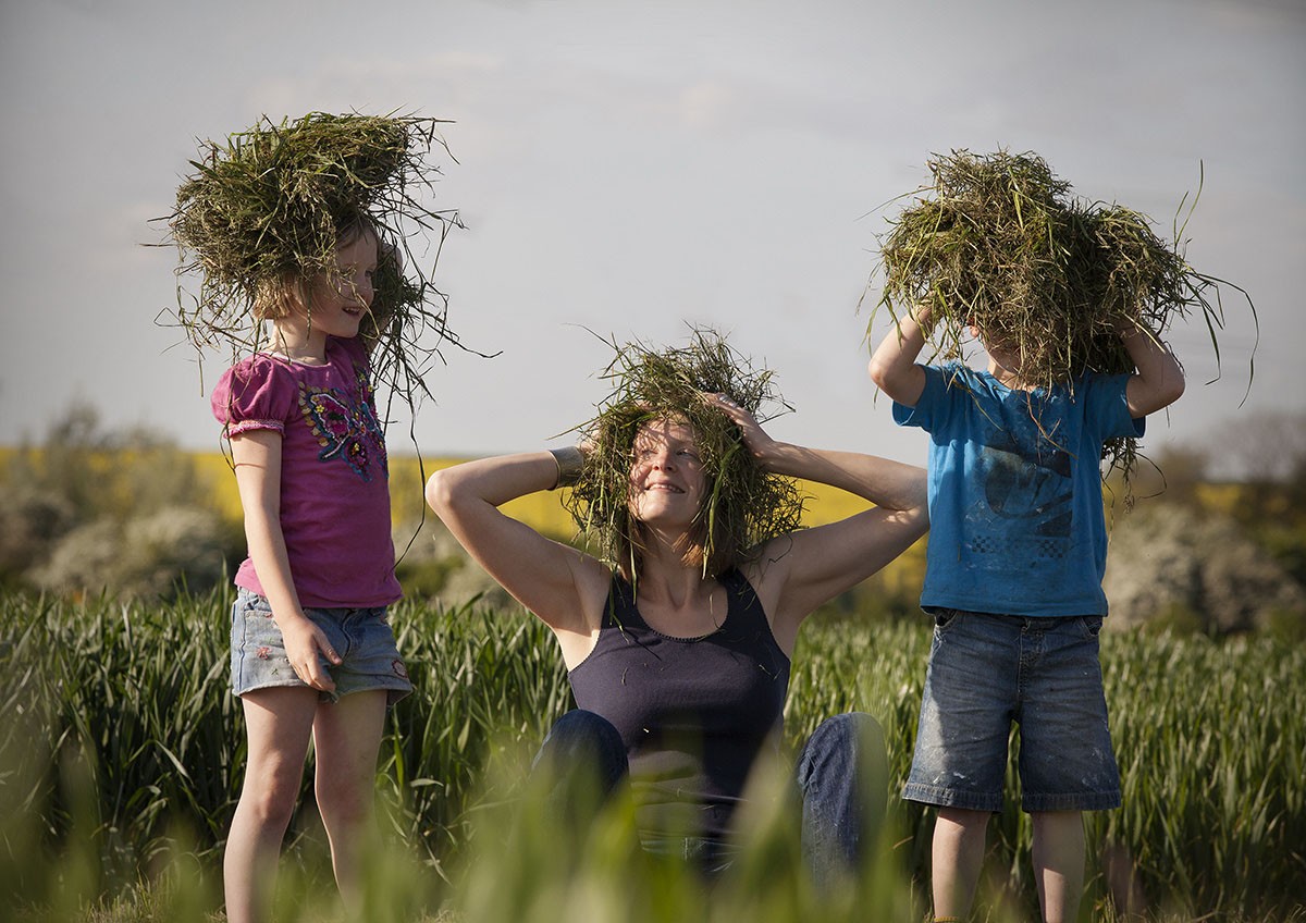 Poppy and her children in a yellow-field wonderland