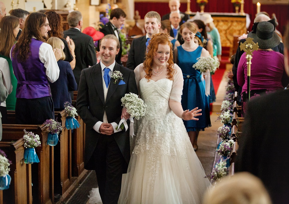 wife and husband leave the church