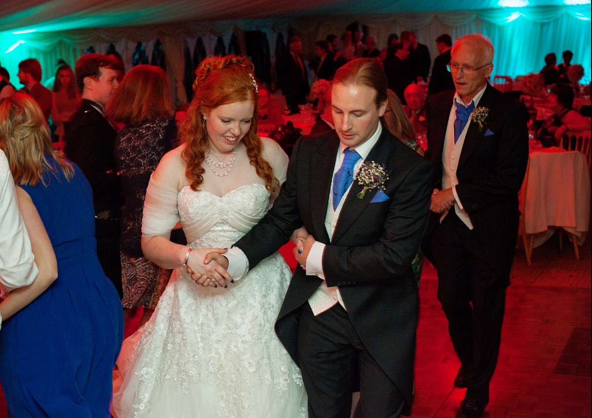 Bride and groom lead the dance