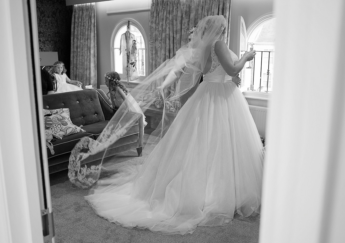 bride looks through the window