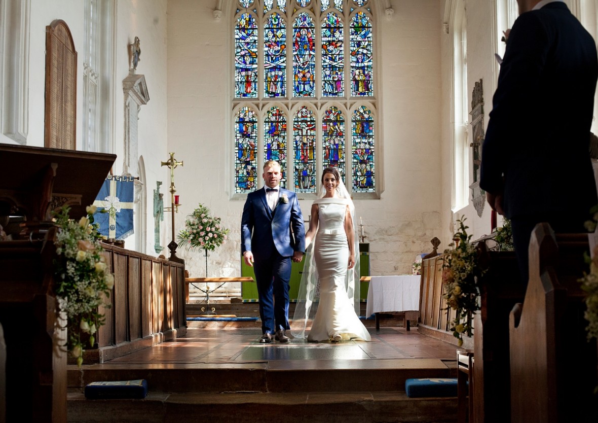 wife and husband leaving the church